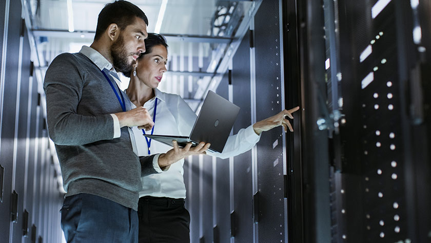 employees in secure data server room of outsourcing company