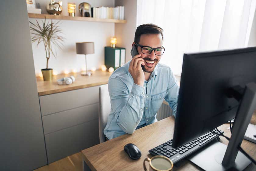 business owner talking on the phone with outsourcing provider