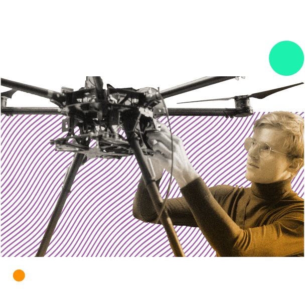 tech industry worker testing drone with blueprints provided by outsourcing company they work with